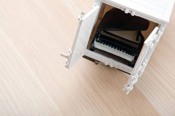 toy car black piano table toy car black piano table piano moving stock pictures, royalty-free photos & images