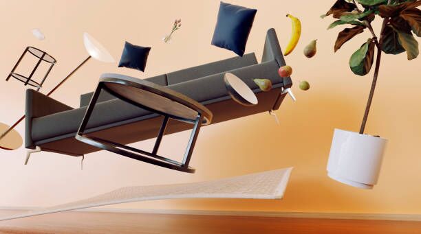 Concept of living room with furniture flying through the air Concept of sofa, table and other furniture items from a living room flying through the air with zero gravity. Maybe due to an earthquake or paranormal activity. moving accident stock pictures, royalty-free photos & images