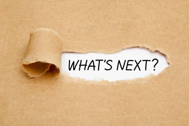 What Is Next Question Ripped Paper Concept Handwritten text question What is Next appearing behind torn brown paper. moving guide stock pictures, royalty-free photos & images