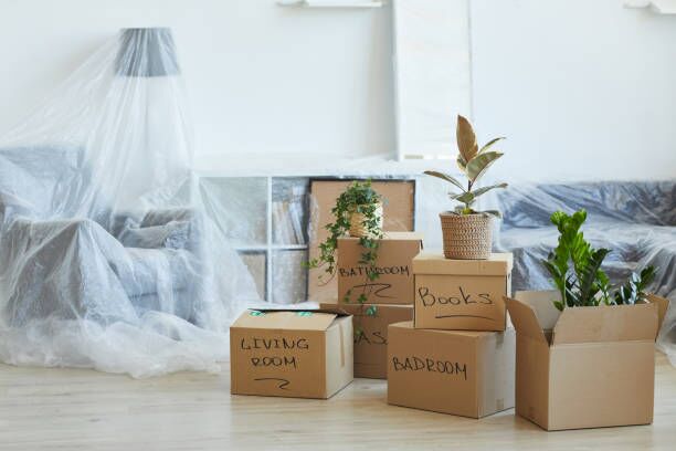 Boxes in the apartment Image of signed cardboard boxes on the floor in the new apartment moving company stock pictures, royalty-free photos & images