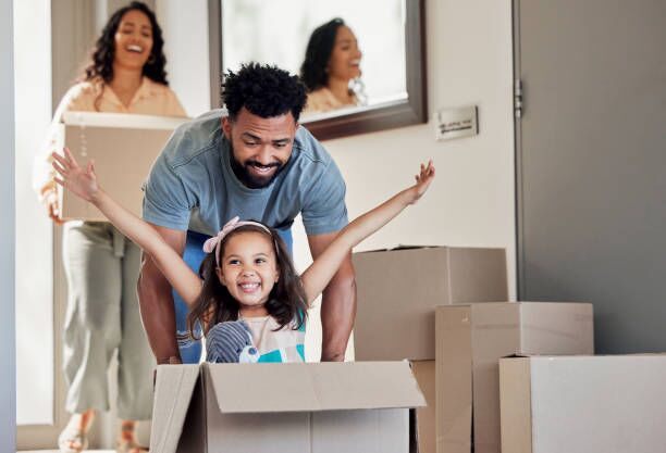 Shot of a young father having fun with his daughter at home I'm so excited relocation stock pictures, royalty-free photos & images