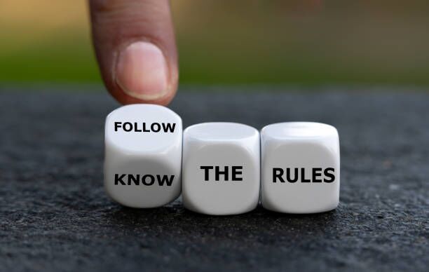 Hand turns dice and changes the expression 'know the rules'. to 'follow the rules'. Hand turns dice and changes the expression 'know the rules'. to 'follow the rules'. Moving regulations stock pictures, royalty-free photos & images