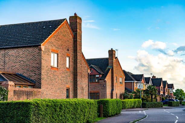 A street on a modern, brick built housing development in the UK A street on a modern, brick built housing development in the UK New city moves stock pictures, royalty-free photos & images