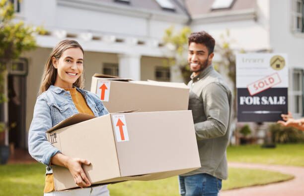 Couple, boxes and portrait for new home, real estate and property, homeowner and outdoor neighborhood. Young and happy interracial people with cardboard, moving in dream house together and sold sign Couple, boxes and portrait for new home, real estate and property, homeowner and outdoor neighborhood. Young and happy interracial people with cardboard, moving in dream house together and sold sign New city moves stock pictures, royalty-free photos & images