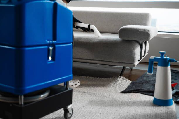 Extracting dust and dirt, removing spots from sofa using extractor to clean upholstered furniture. Refreshing sofa and cushions from dust and dirt with dry-cleaning extractor. Extracting dust and dirt, removing spots from sofa using extractor to clean upholstered furniture. Refreshing sofa and cushions from dust and dirt with dry-cleaning extractor gun safe movers stock pictures, royalty-free photos & images
