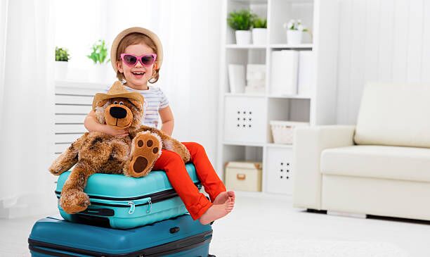happy child girl collect suitcase on vacation happy child girl collect the suitcase on vacation children packing stock pictures, royalty-free photos & images