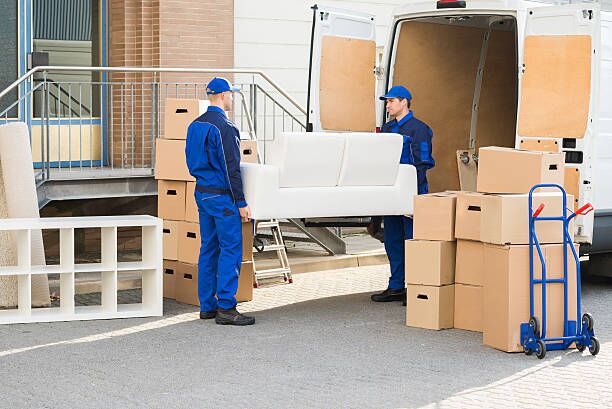 Movers Carrying Sofa Outside Truck On Street Full length of young male movers carrying sofa outside truck on street moving truck stock pictures, royalty-free photos & images