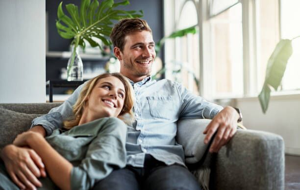 This is what a weekend should look like Cropped shot of an affectionate young couple relaxing at home Beautiful home stock pictures, royalty-free photos & images
