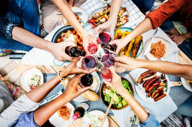 Aerial view of people toasting together Aerial view of people toasting together restaurants in communities stock pictures, royalty-free photos & images