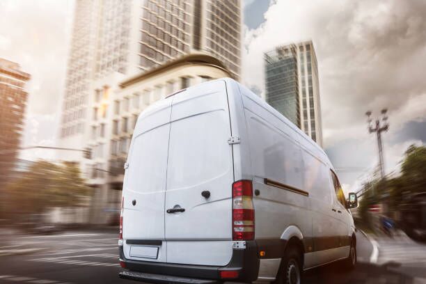 delivery trucks in the city delivery trucks moving company stock pictures, royalty-free photos & images