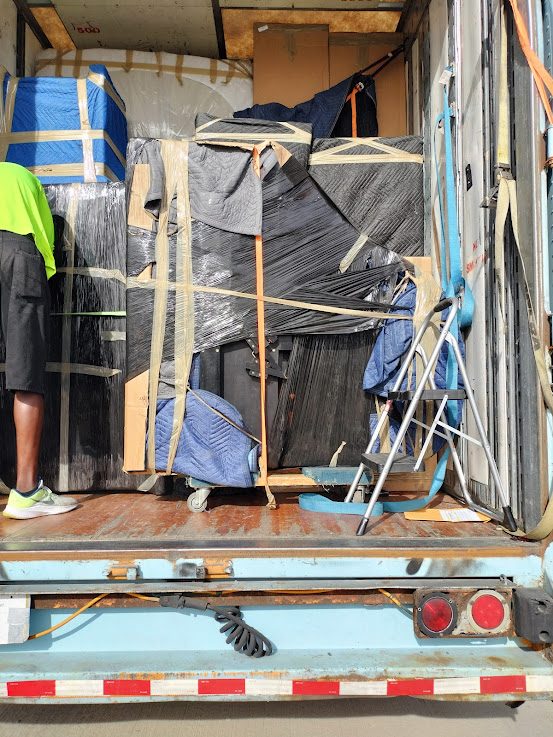 Moving Company Guys crew on a job in Campbell Road — Dallas, TX