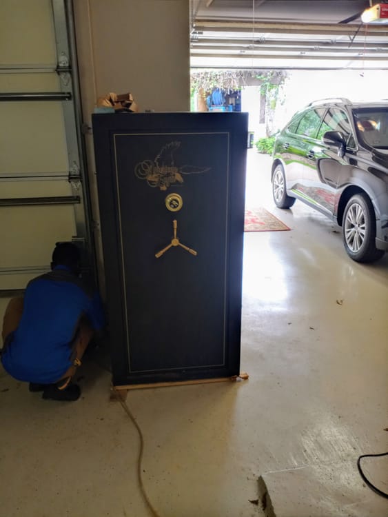 Gun safe movers in Arlington, TX moving a gun safe — Moving Company Guys