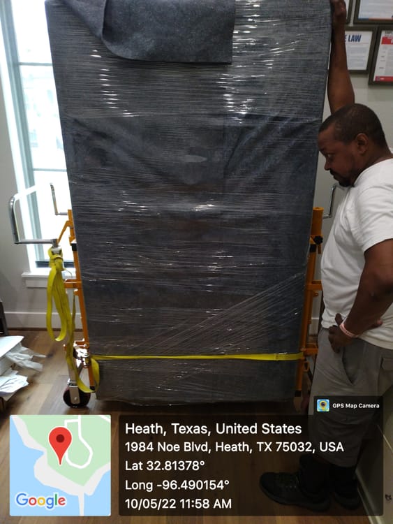 Gun safe movers in Carrollton, TX moving a gun safe — Moving Company Guys