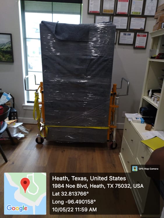 Gun safe movers in Colleyville, TX moving a gun safe — Moving Company Guys