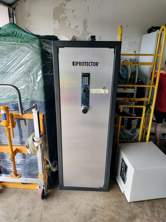 Gun safe movers in Mansfield, TX moving a gun safe — Moving Company Guys
