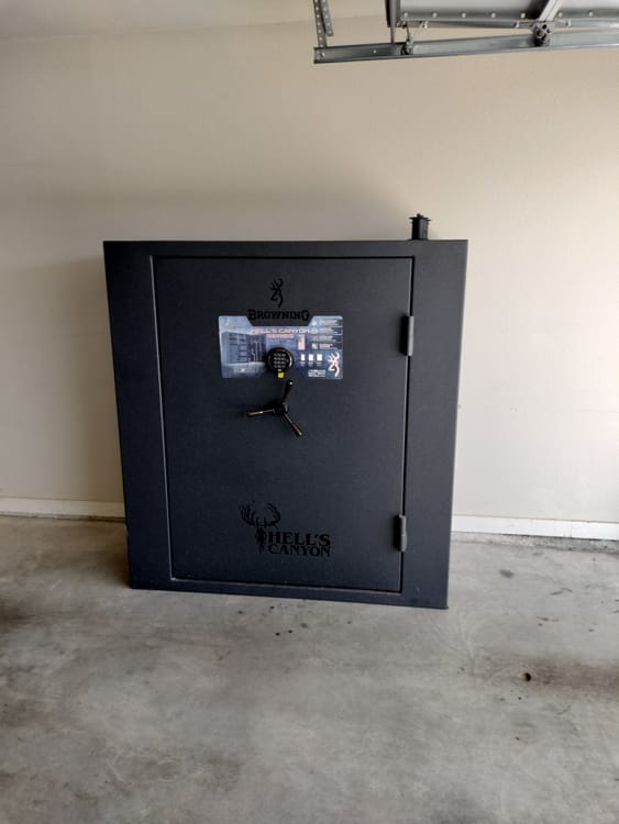 Gun safe movers in Richardson, TX moving a gun safe — Moving Company Guys