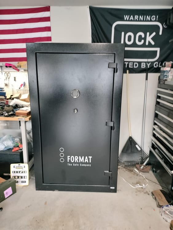 Gun safe movers in Sachse, TX moving a gun safe — Moving Company Guys