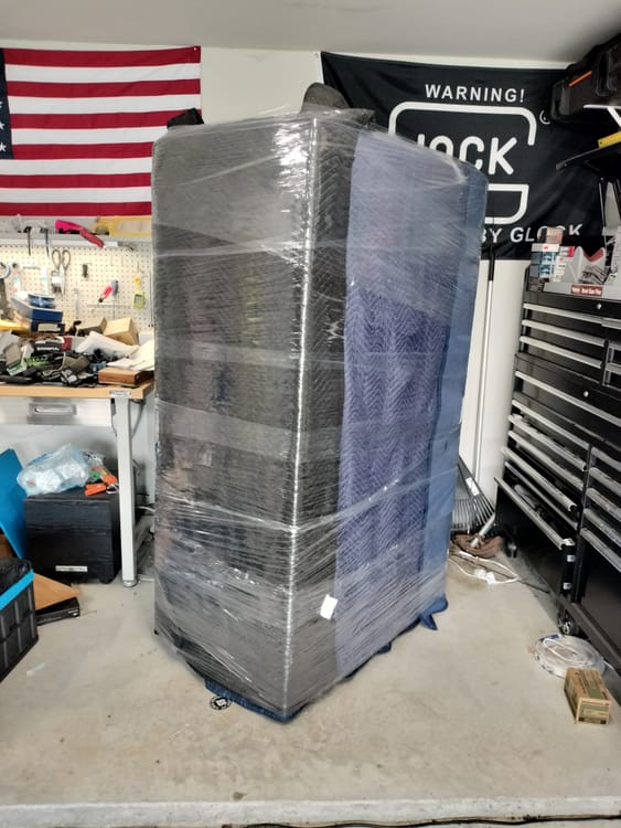 Gun safe movers in Seagoville, TX moving a gun safe — Moving Company Guys