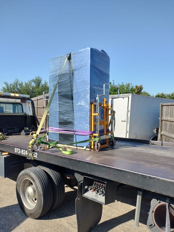 Gun safe movers in Trophy Club, TX moving a gun safe — Moving Company Guys