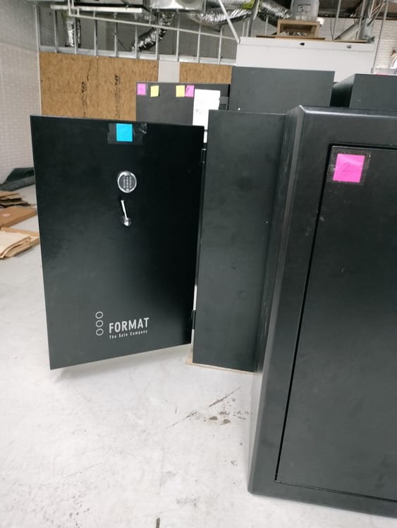Gun safe movers in Waxahachie, TX moving a gun safe — Moving Company Guys